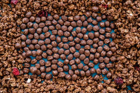 top view of tasty cereal balls near crunchy chocolate granola