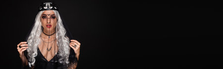 crowned woman with long and blonde hair and veil isolated on black, bannerの写真素材