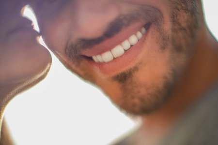 close up of cropped and pleased bearded man near girlfriendの写真素材