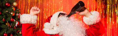 Father christmas in sunglasses drinking champagne from bottle near tinsel, bannerの写真素材