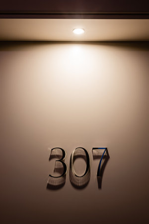 room door with three hundred and seven numbers in hotelの写真素材