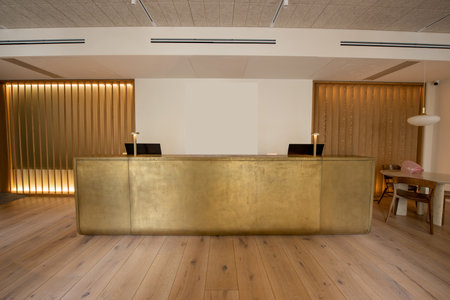 computer monitors at luxury reception desk in hotelの写真素材