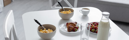 high angle view of tasty breakfast near beverages on kitchen table, banner