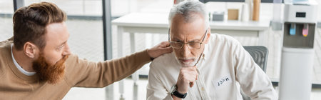 Man calming member of alcoholics group in rehab center, banner