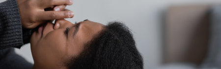 heartbroken multiracial woman with psychological problem crying at home, bannerの写真素材