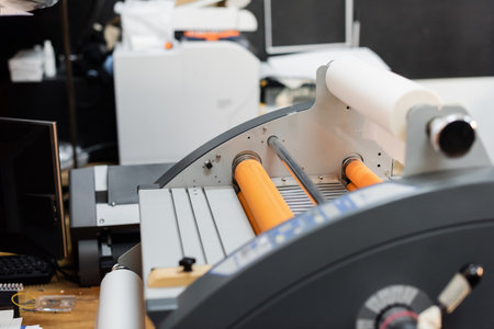 paper roll inside of professional print plotter in copy centerの写真素材