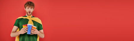 coffee addict, redhead and curly man holding paper cups with hot beverages, takeaway drink, energy and coffee, ginger, hipster, urban style, fashionable and trendy, lifestyle, bannerの写真素材