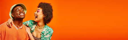 Excited young african american woman with bold makeup hugging cheerful best friend in summer outfit...