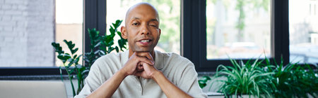 ptosis, eye syndrome, bold african american businessman looking at camera, cheerful dark skinned office worker with myasthenia gravis disease, diversity and inclusion, bannerの写真素材