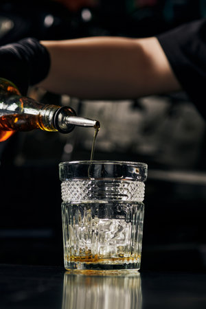 glass with ice, barista preparing ice caramel latte, pouring syrup, summer drink, deliciousの写真素材