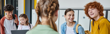 banner, happy redhead boy holding smartphone and looking at girl, blurred foreground, teen students