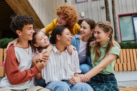 cultural diversity, back to school happy african american woman hugging with teenage students