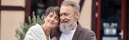 happy man and woman hugging, senior couple with closed eyes, romance, love, seniors on date, banner
