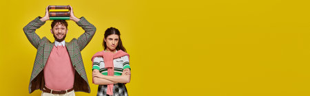 displeased woman standing near happy man with books on head, different emotions, horizontal banner