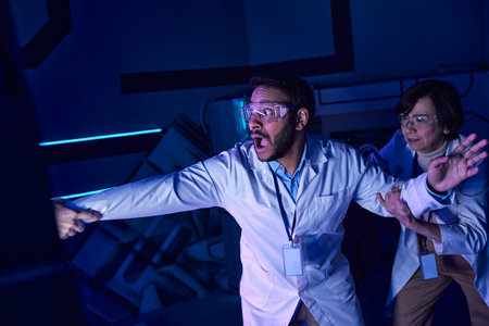 exploring future, shocked multiethnic scientists near hand appearing from experimental device