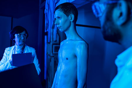 futuristic concept, unknown cosmic creature near scientists in neon-lit innovation hubの写真素材