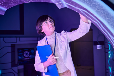 Futuristic Expertise: Adult Woman Scientist in the Science Center of Tomorrowの写真素材