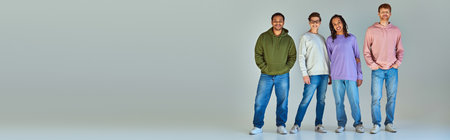 four young multicultural men in street wear looking and smiling at camera, diversity, banner