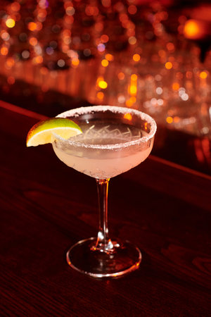 freshening ice cold margarita drink decorated with lime slice on bar counter, conceptの写真素材