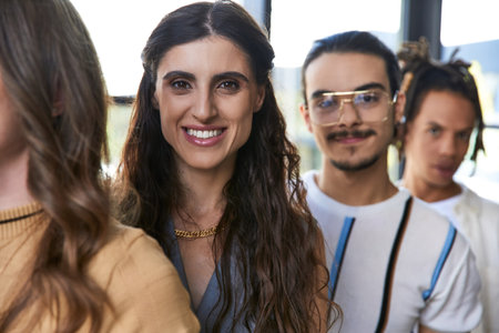 headshot of joyous businesswoman near diverse multiethnic business team, leadership and confidenceの写真素材