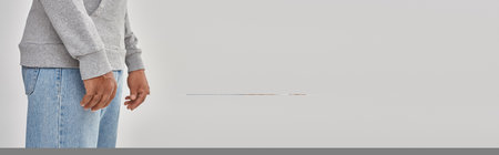 elegant young african american man in jeans and sweatshirt, copy space for advertising, bannerの写真素材