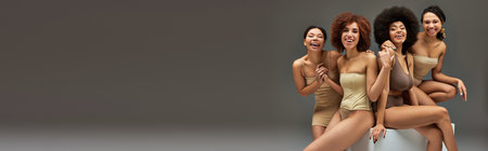 appealing happy african american women in comfy underwear having great time together, bannerの写真素材