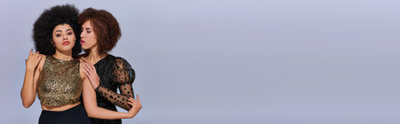 two beautiful african american female friend spending time together partying actively, bannerの写真素材