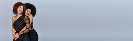 pretty happy african american women in festive attires partying together, fashion concept, bannerの写真素材