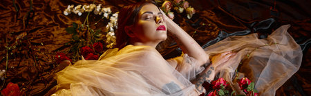 banner of charming young woman in romantic transparent dress lying among flowers, closed eyes