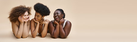 cheerful multiethnic plus size women in lingerie lying down on beige, beauty and happiness, bannerの写真素材