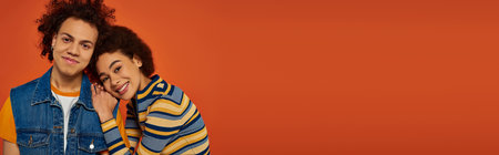 cheerful young african american siblings in casual attire having great time together, family, bannerの写真素材