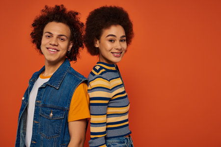 merry young african american siblings in casual attire having great time together, family concept