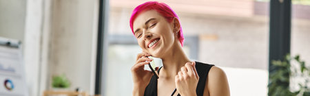 cheerful female worker talking by phone and smiling with closed eyes, business concept, bannerの写真素材