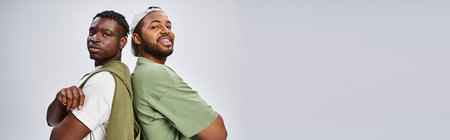 banner of african american friends standing with folded arms on grey background, Juneteenthの写真素材