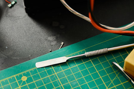 top view of special tool for diagnostics of electronic devices on table in professional workshop