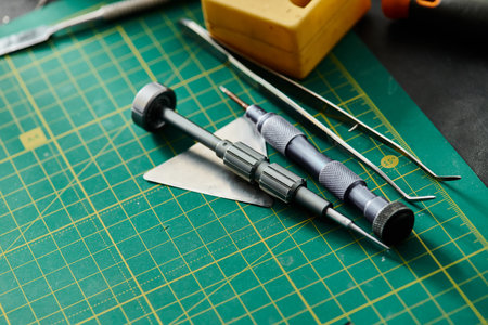 top view of special tools for maintenance of electronic devices on table in professional workshop