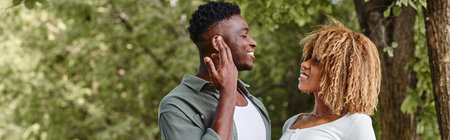 sign language banner, positive african american couple communicating with gestures outdoors