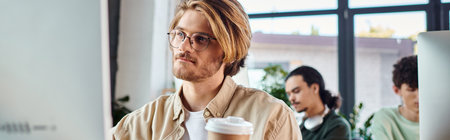 banner of man working on creative project and using computer monitor in office, retouching team