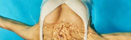 banner of cropped african american woman swimming on her back in clear pool water, tranquilityの写真素材