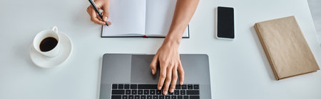 top view banner, african american woman with pen in hand using laptop next to cup of coffee on desk