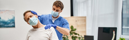 handsome doctor with gloves helping his patient to stretch his muscles, rehabilitation, banner