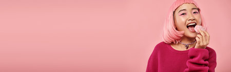 horizontal view of asian woman with pink hair eating mochi with admiration on vibrant background
