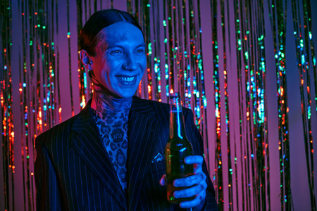 Business man in suit and tie holding a beerの写真素材