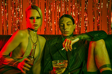 A couple seated together on a comfortable couchの写真素材