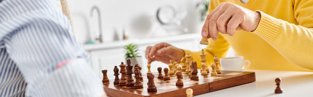 A mature loving couple in cozy homewear deeply focused on a game of chess, pondering their next...