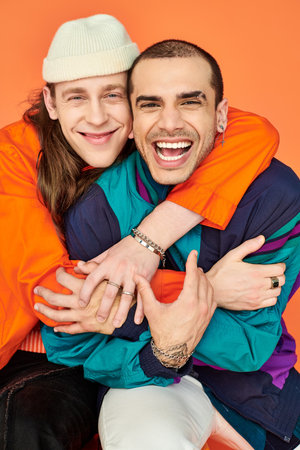 Two loving gay men hugging each other closely.