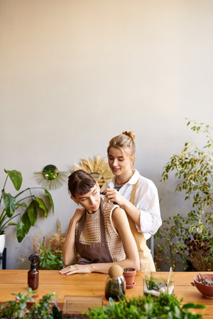 Two women enjoy art at a table.の写真素材