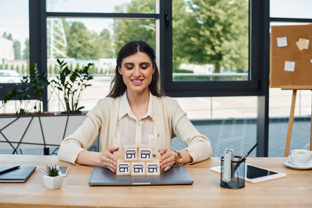 A businesswoman sits at a table, focused on blocks in a modern office setting, embodying the...