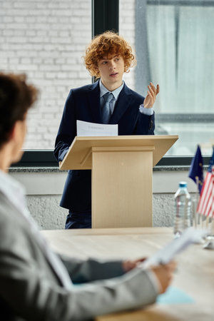 A young delegate delivers a speech at a UN Model Conference.の写真素材