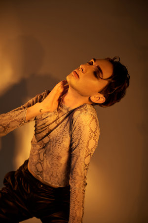 A stylish young queer person proudly displaying a snake coiled around their chest, exuding...
